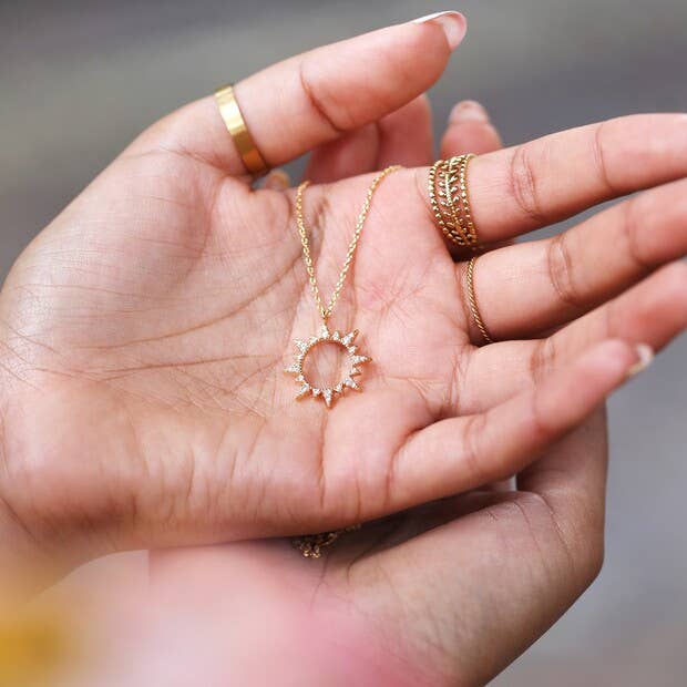 Crystal Sunburst Pendant Necklace in Gold